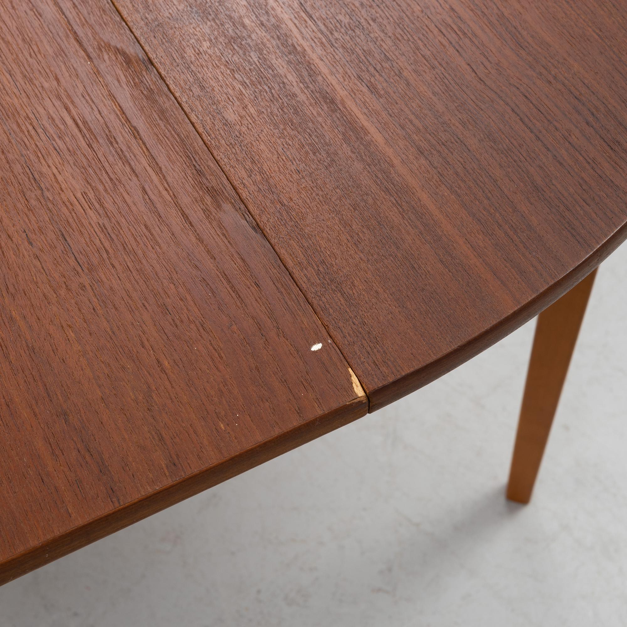 A mid 20th century teak veneer table.