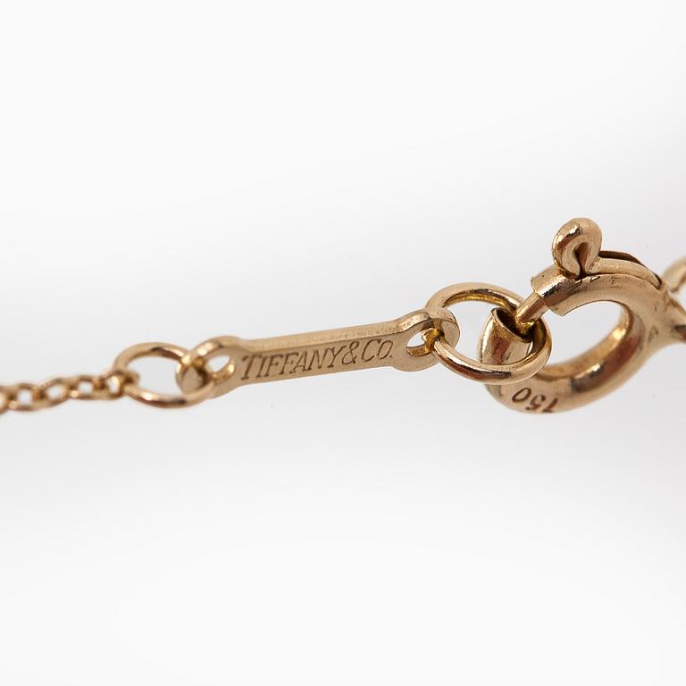 Tiffany & Co, Paloma Picasso, an 18K gold "X Kiss" necklace.