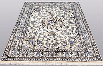 A rug, Nain part silk, ca 235 x 160 cm.