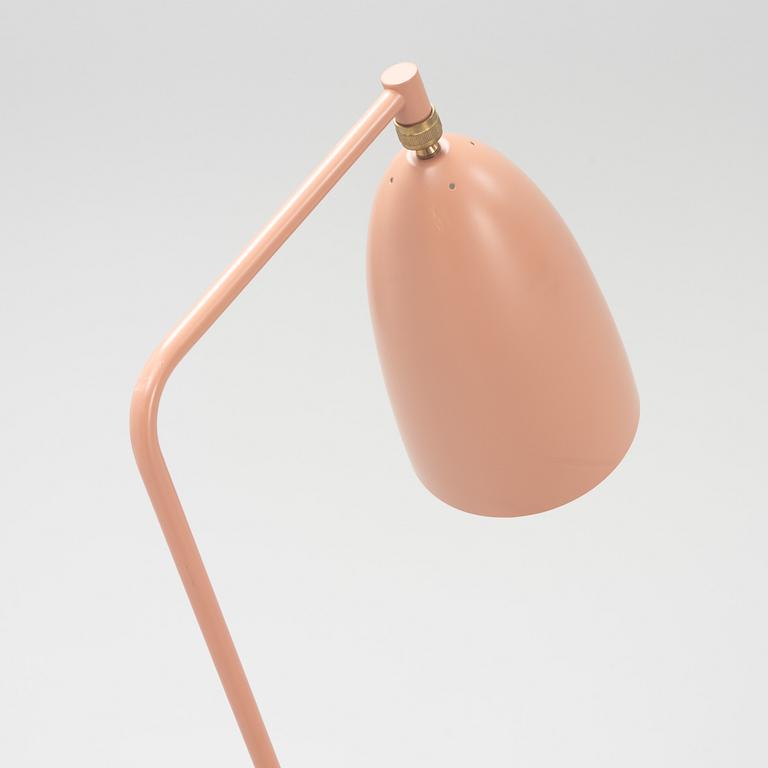 A 'Grasshopper' floorlamp by Greta Magnusson Grossman for Gubi.