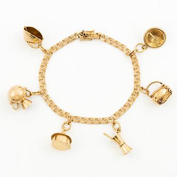 Bracelet, 18K gold bismarck link. With charms.