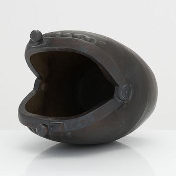 Outi Leinonen, a ceramic vase formed as a purse for Pentik, Finland.