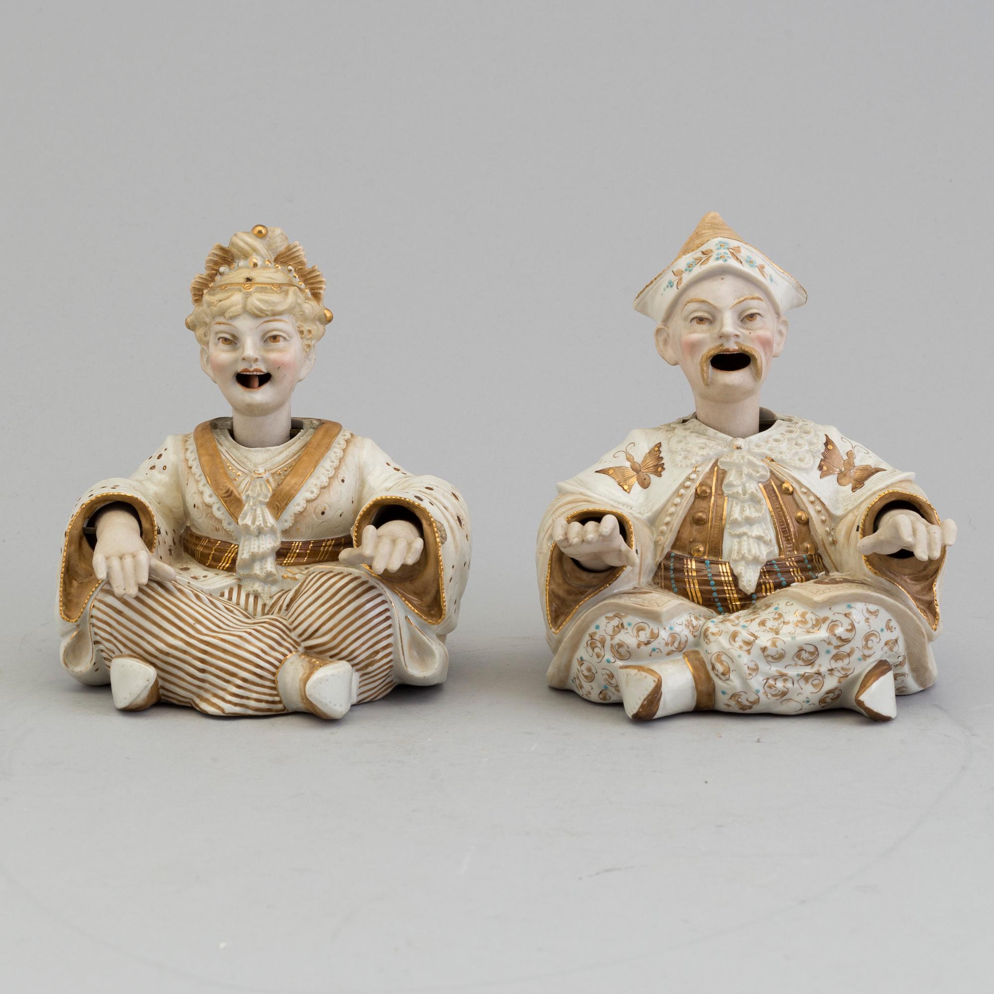 A pair of Chinese style 20th century porcelain nodding figures.