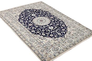 A part silk Nain rug, 9LA, c. 292 x 190 cm.