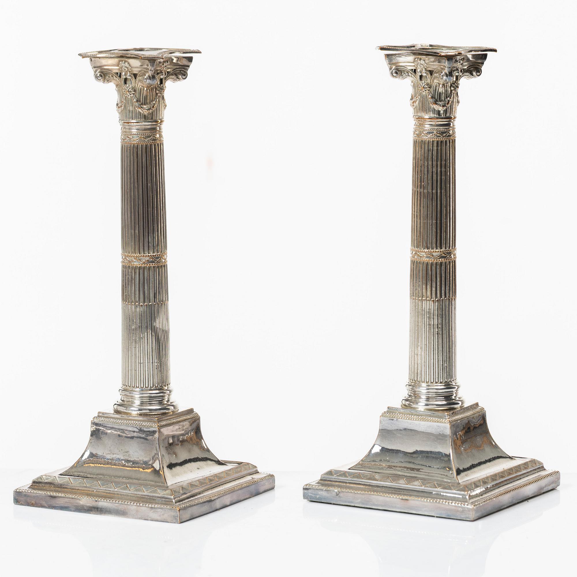 Four silver plated candlesticks, early 20th century.