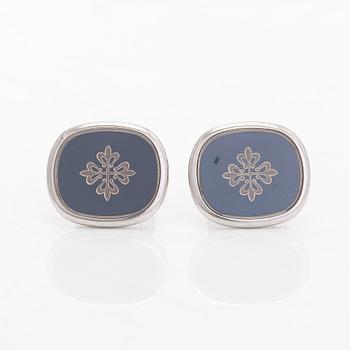 Patek Philippe, a pair of 18K whitegold 'Calatrava' cufflinks.