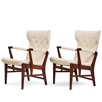 Bertil Söderberg, a pair of mahogany Swedish Modern easy chairs, Nordiska Kompaniet, 1940's.