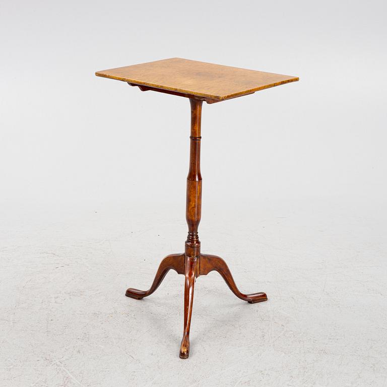 A drop-leaf table, 19th Century.