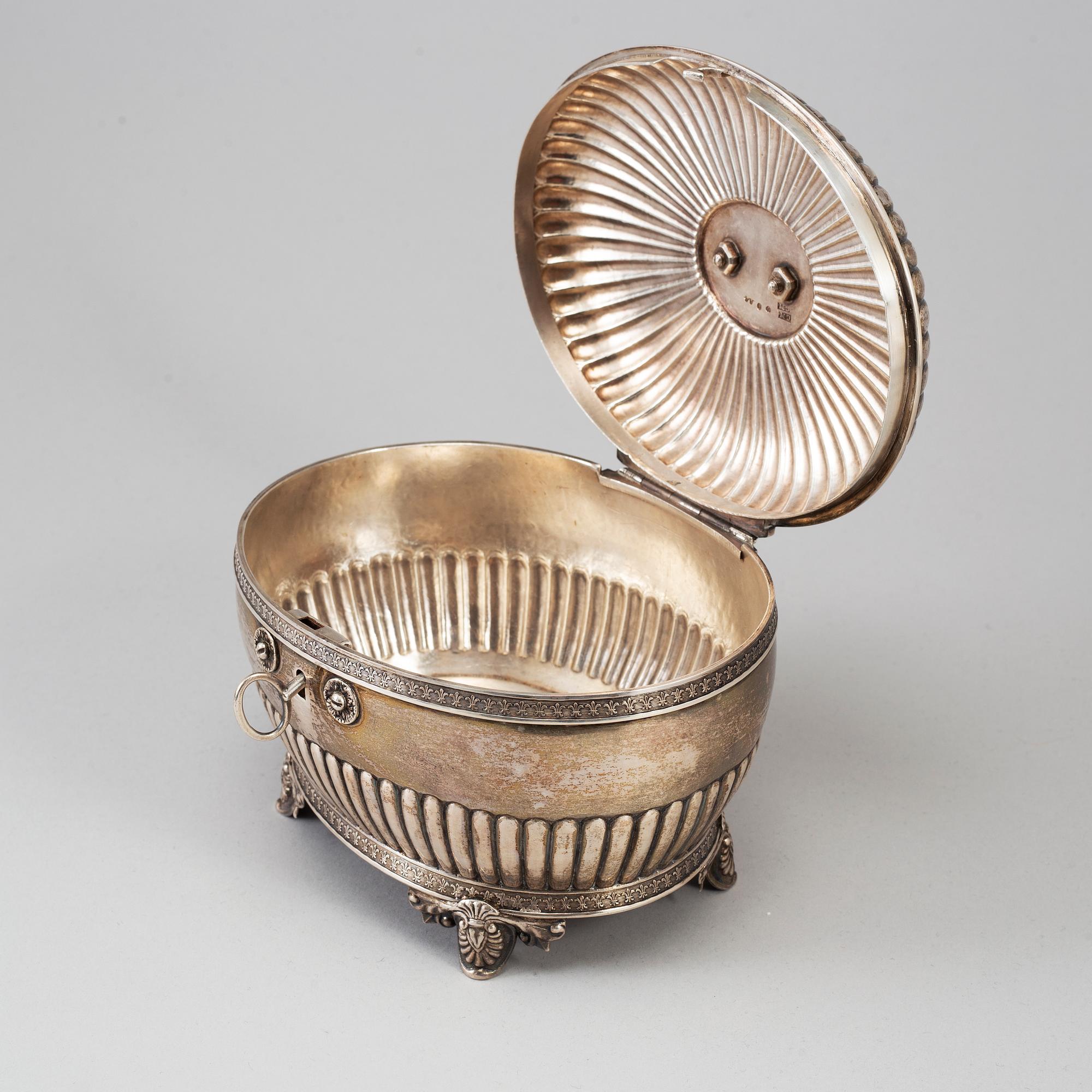 A silver sugar bowl and tongs, Gustaf Möllenborg, Stockholm 1831 and Michael Olof Barkman, Varberg 1824.