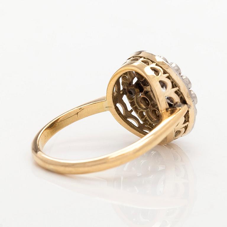 An 18K gold ring, set with old- and single-cut diamonds.