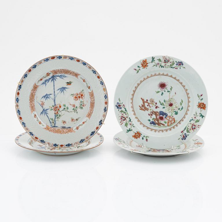 A set of four (2+2) famille rose dinner plates, Qing dynasty, 18th Century.