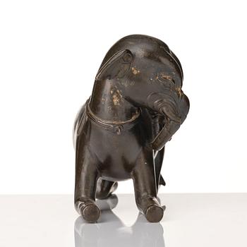 A bronze figure/censer of a reclining elephant, Qing dynasty, 19th Century.