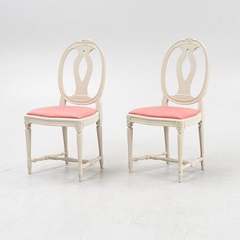 A Gustavian style table with four chairs, second half of the 20th century.