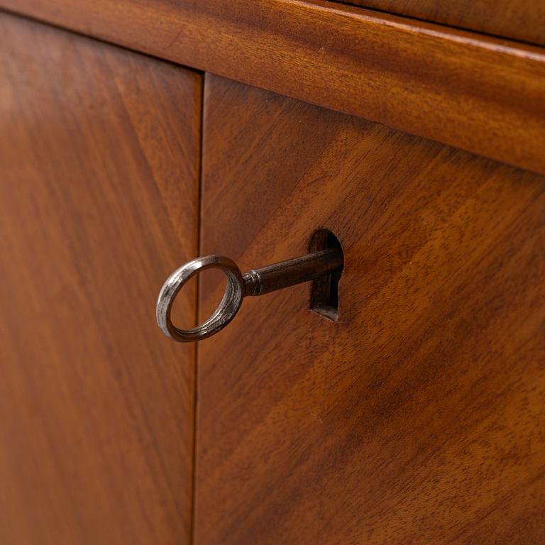 A ahogany-veneered 1940's/50's bookcase.