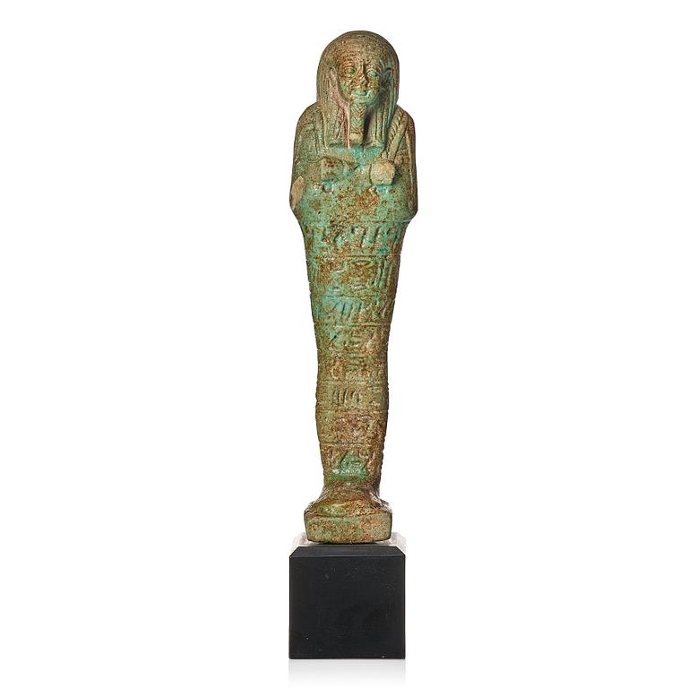 A light green pottery Ushabti Egypt presumably 26:e dynasty ca 650 B.C.