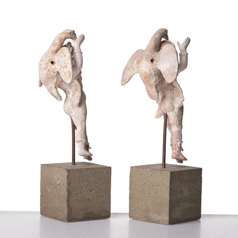 A pair of greek pottery figures of Zeus and Ganymede, Hellenistick period, circa 2nd Century B.C.