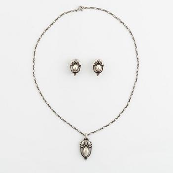 A Georg Jensen pendant and a pair of earrings in silver.