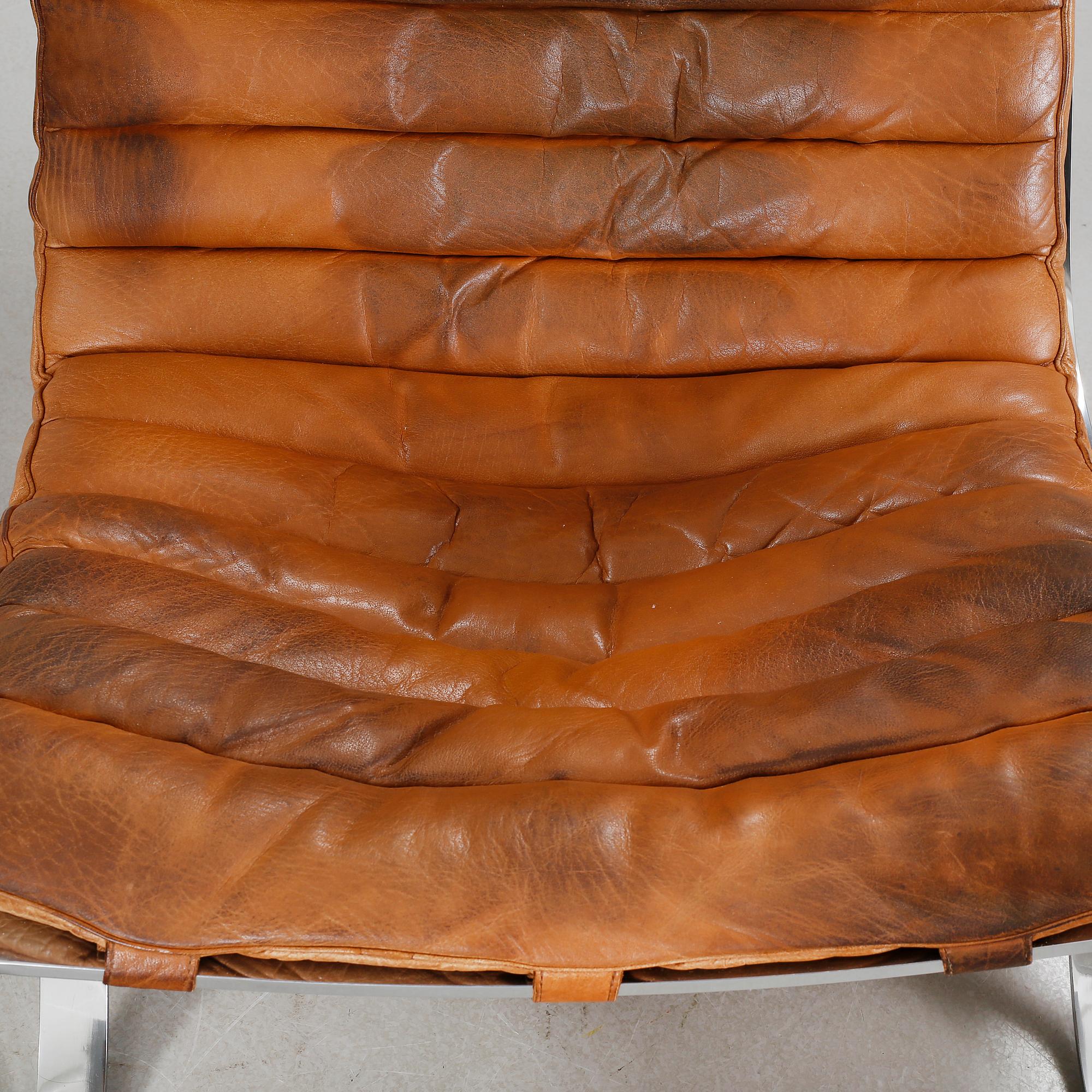 ARNE NORELL, fåtöljer, ett par med fotpallar, "Ari". Formgivna 1966.