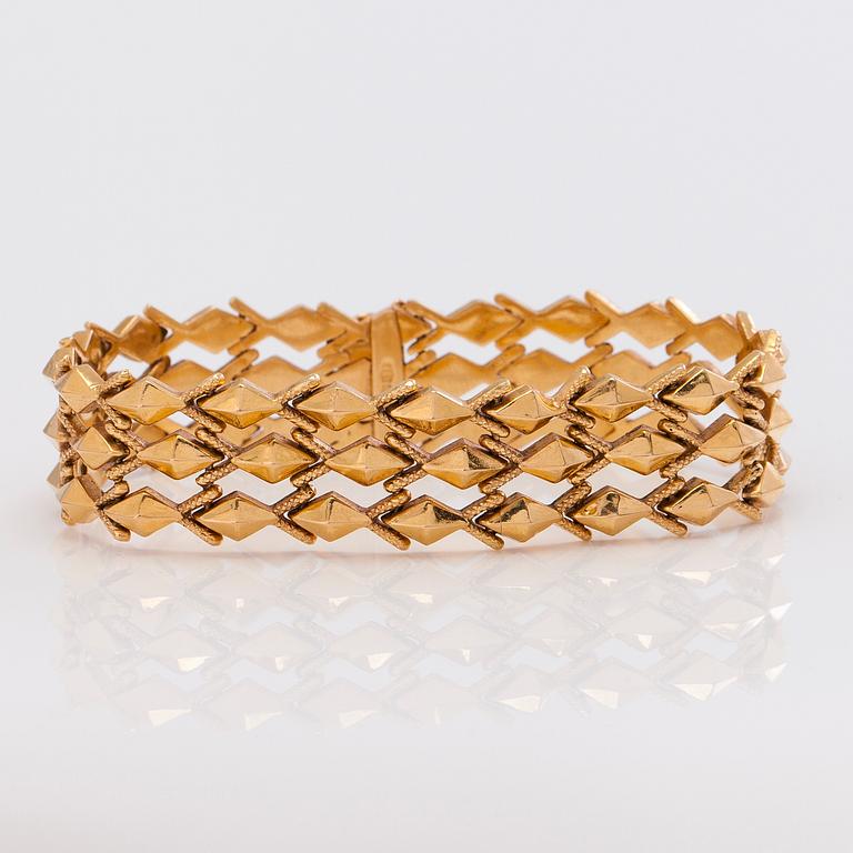 A 14K gold bracelet.