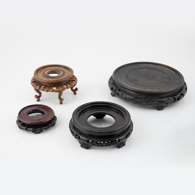A group of nine hardwood stands, late Qing dynasty and 20th Century.