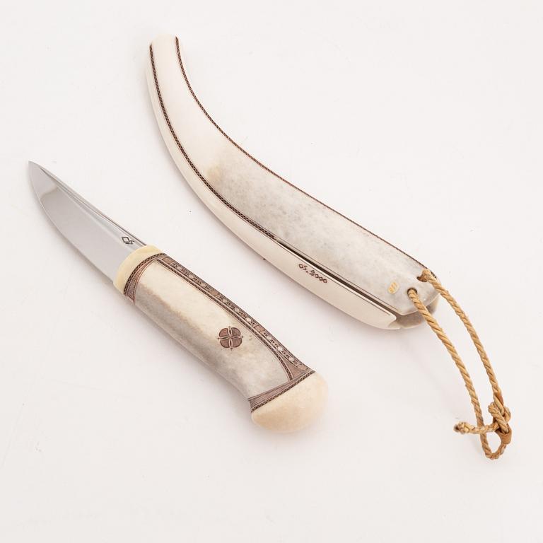 A reindeer horn knife by Olav Svonni, signed and dated 2000.