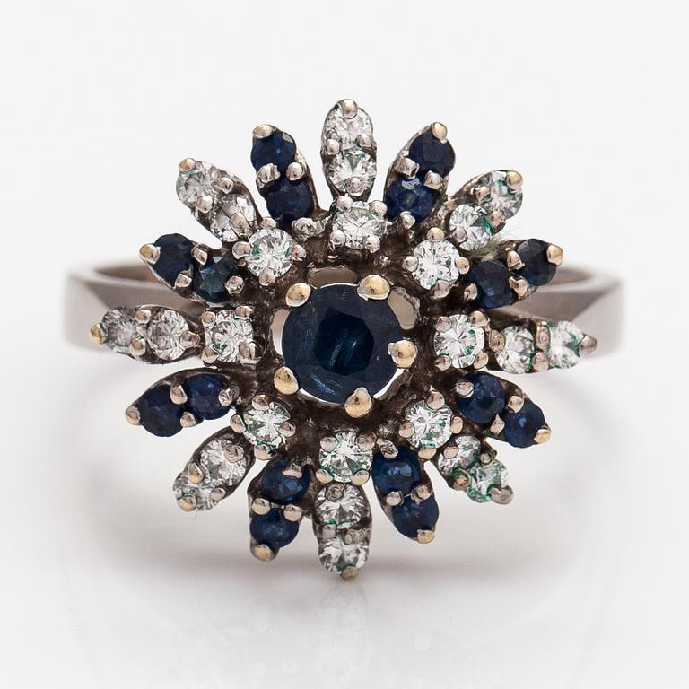 An 18K white gold ring with diamonds ca. 0.56 ct in total and sapphires. J S Guldsmide, Gothenburg 1991.