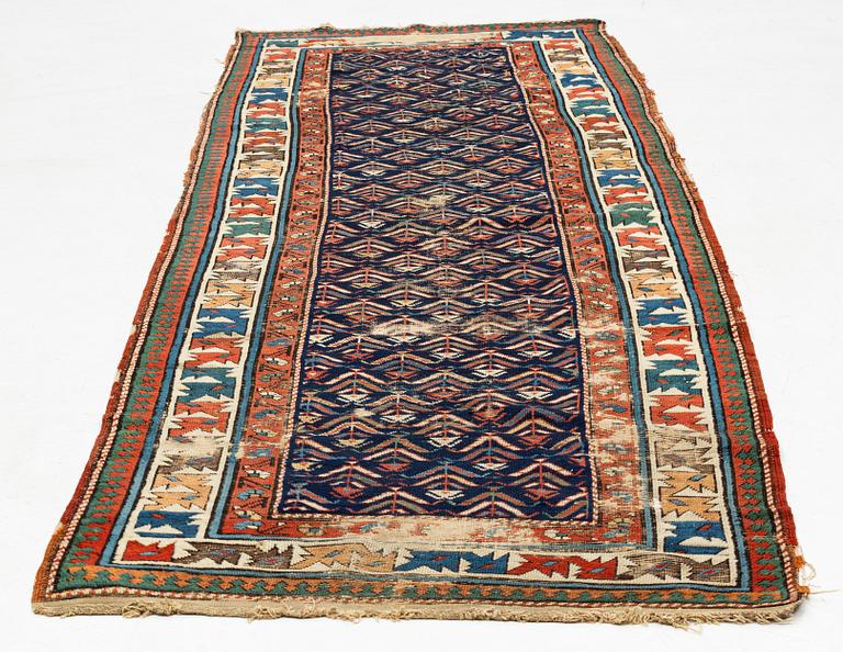 A antique Kazak gallery carpet, ca 310 x 105 cm.