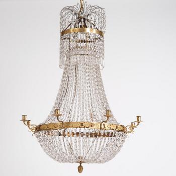 An Empire nine-light gilt-brass and cut-glass, Stockholm, early 19th century.