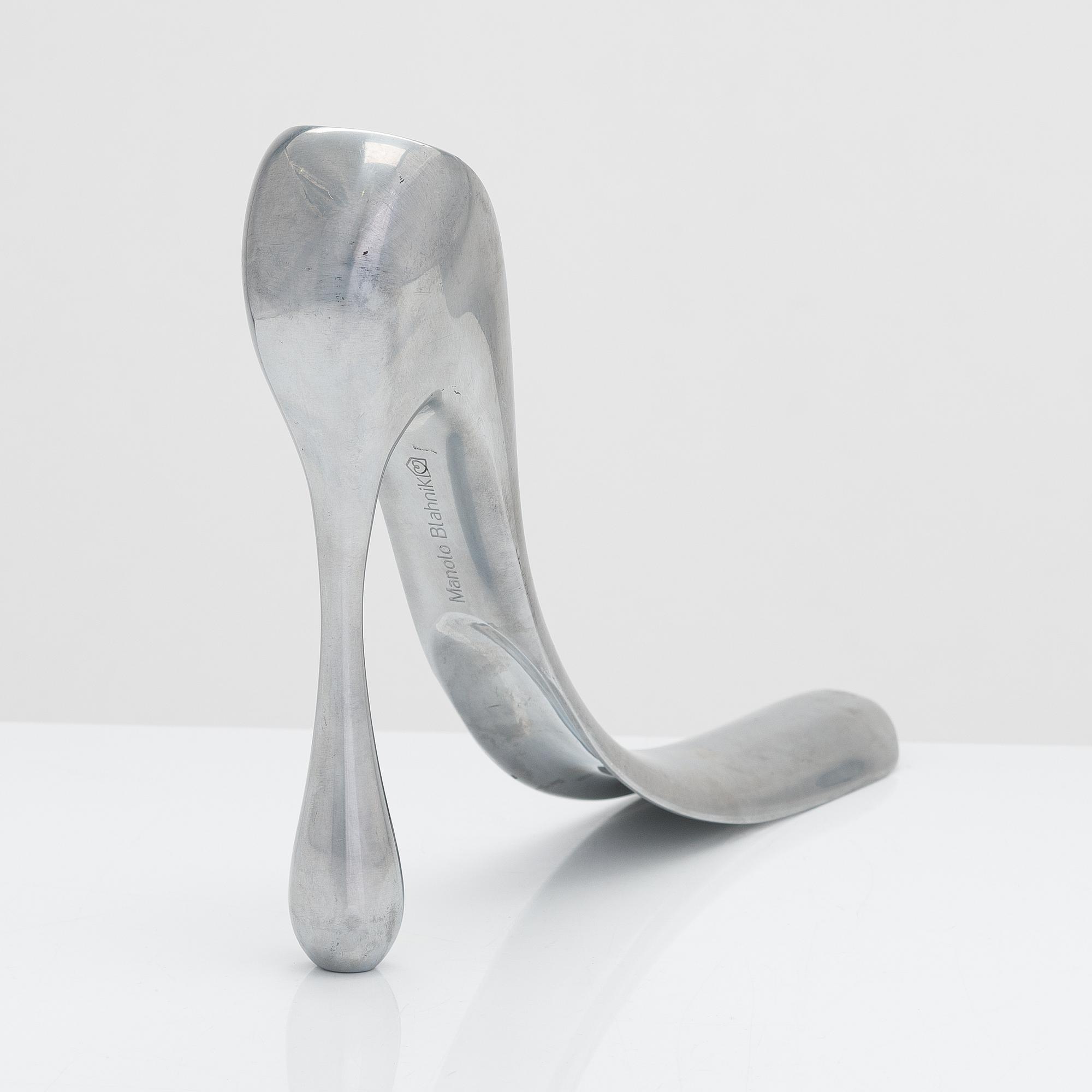 A metal shoe horn by Manolo Blahnik, 2000s.