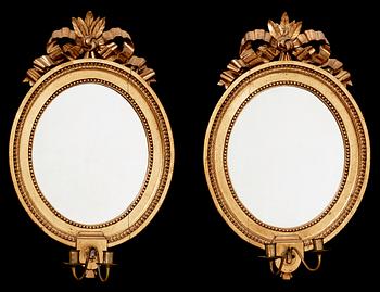 1259. A pair of Gustavian late 18th century two-light girandole mirrors.