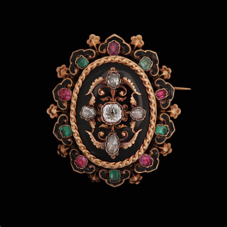 An antique- and rose cut diamond brooch / pendant set with rubies and emeralds. 19th century, France.