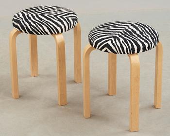 A pair of Alvar Aalto stools for Artek, Finland 2002.