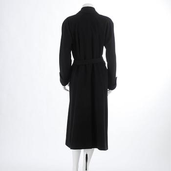 CÉLINE, a black cashmere and wool coat.