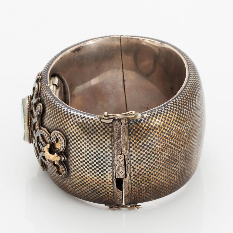 Silver bangle with watch.