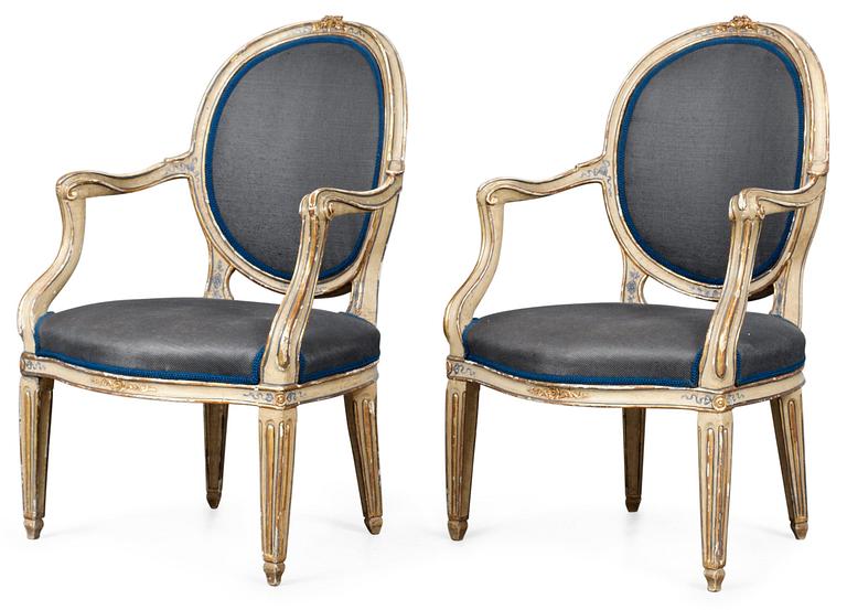 A pair of late 18th century armchairs.
