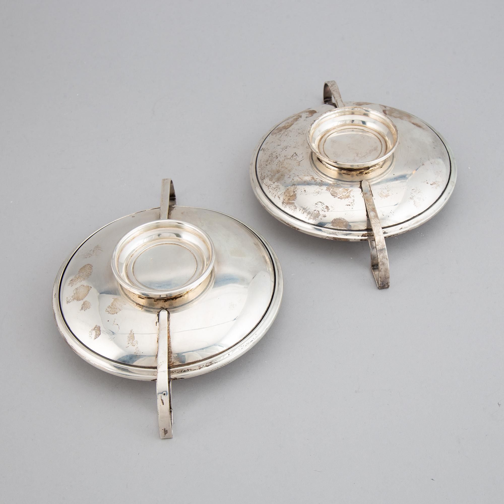 A pair of sterling silver tazzaz.