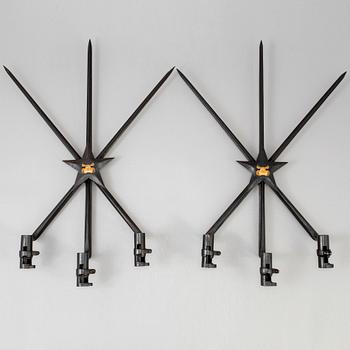 A pair of steel wall sconces made from bayonets, 20th Century.