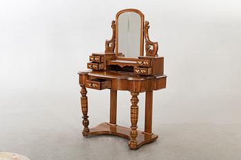 A second half of the 19th century table with mirror and a stool.