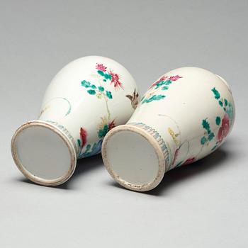 A pair of famille rose vases with covers, Qing dynasty, Qianlong (1736-95).