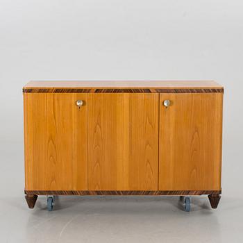 A "MODEL OK" SIDEBOARD DESIGNED BY AXEL EINAR HJORTH FOR NORDISKA KOMPANIET.