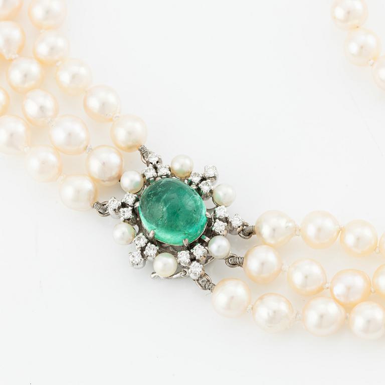Necklace, three-strand, cultured pearls, clasp by Carlman 18K white gold with cabochon-cut emerald, pearls, and diamonds.