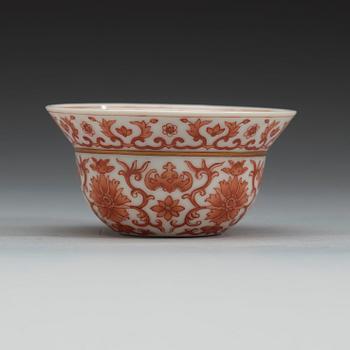 A set of three red lotus cups, Qing dynasty with Daoguangs sealmark and period (1821-50).