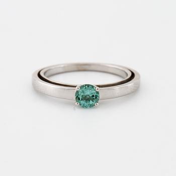 A tourmaline and brilliant cut diamond ring.