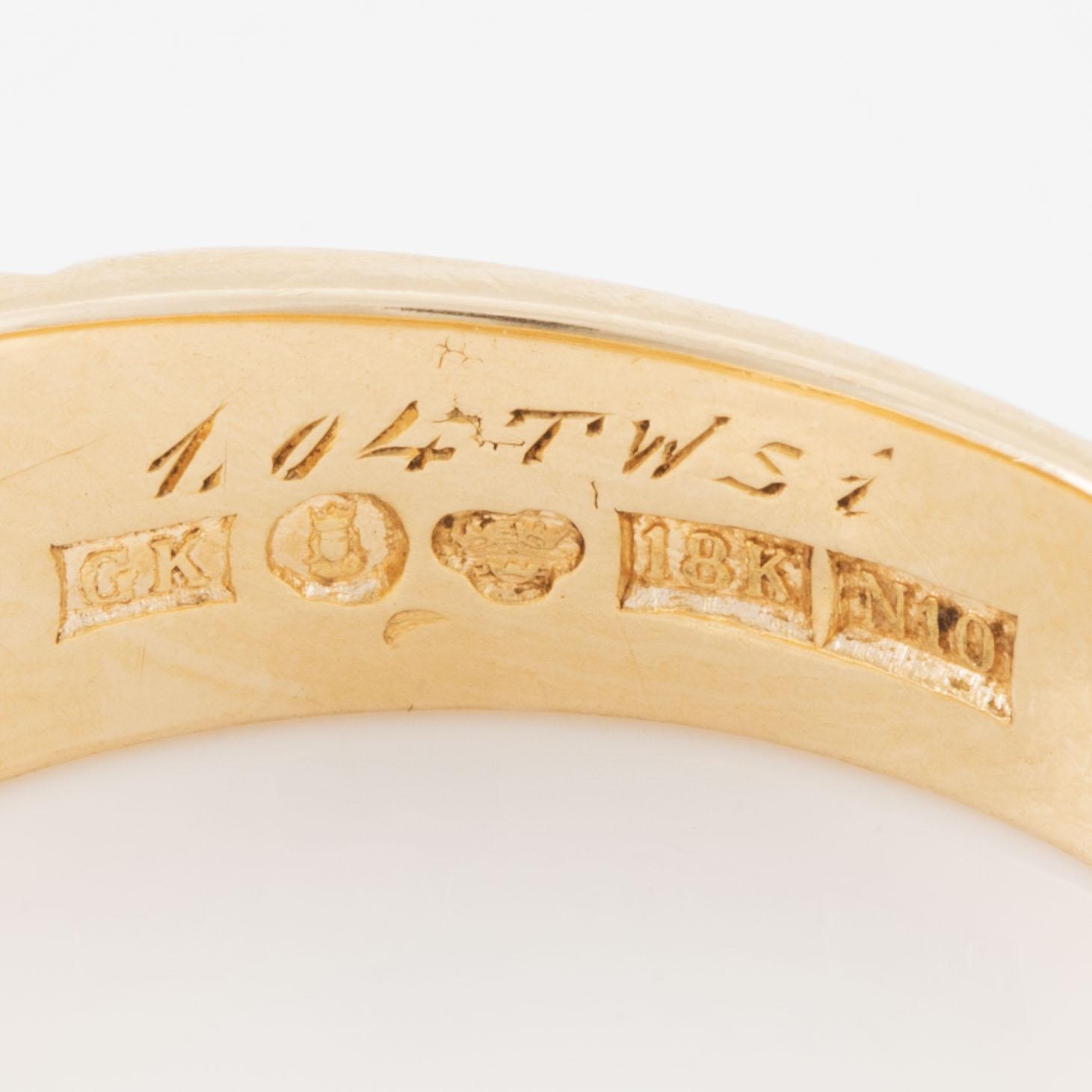 Ring, 18K gold with emerald-cut diamond.