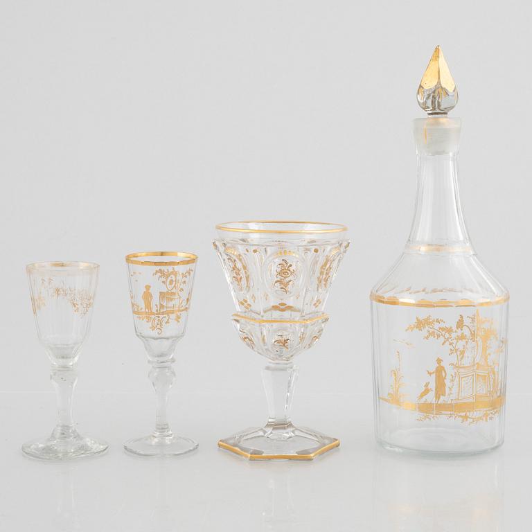 Two sets of wine glasses and a decanter with stopper, later part of the 18th century and later part of the 19th century.