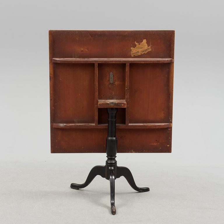 A 19th century folding table with root veneer.