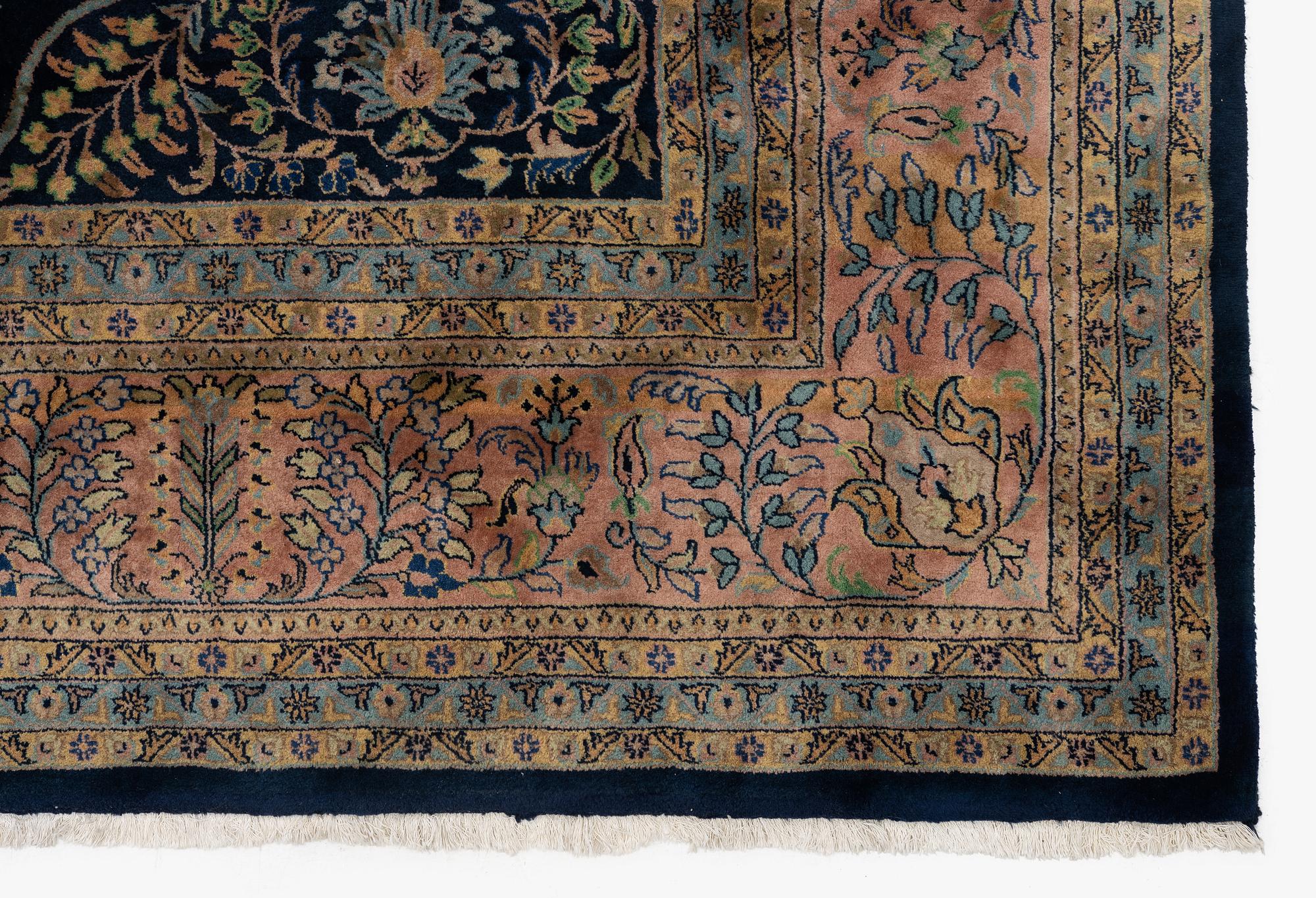 An India Carpet, c. 380 x 285 cm.