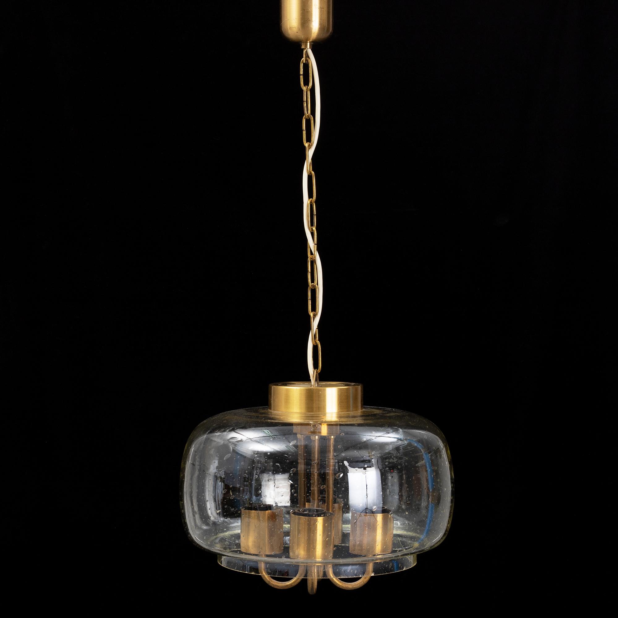 A 1960/70s glass and brass ceiling lamp.