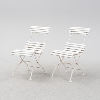 A garden sofa and four chairs, mid 20th Century.