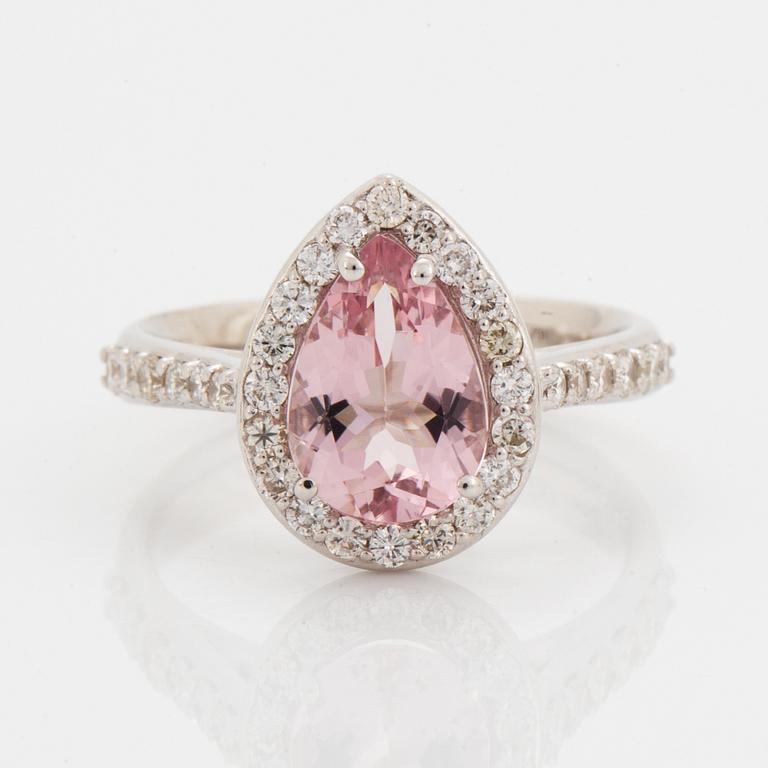 An 18K gold ring set with a faceted morganite.
